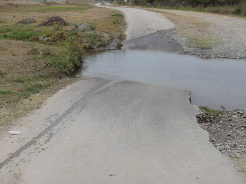 Passing through little water drainage ditches became <i>de rigor</i>.